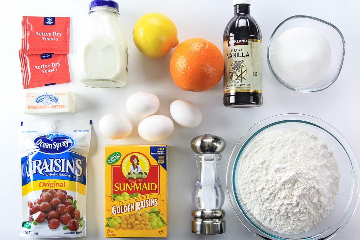 This buttery panettone bread recipe is loaded with fragrant citrus zest, dried cranberries, and golden raisins. The warm fluffy texture will blow your mind! #panettone #christmasbread #italianbread #italianchristmas ingredients for panettone bread