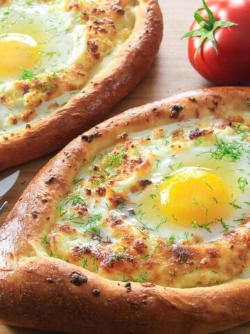khachapuri cheese bread boat with an egg in the center