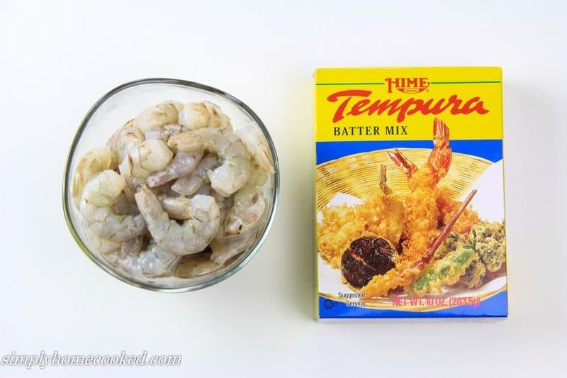 Ingredients for Shrimp tempura, including raw shrimp and a box of tempura batter mix.