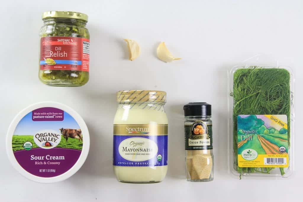 Nothing sets off onion rings or fried seafood like a delicious dipping sauce. This simple tartar sauce can be made with ingredients that are on hand and be ready in minutes. #tartarsaucerecipe #seafooddippingsauce #dippingsaucerecipe #seasfoodsauce Ingredients for tartar sauce: Jar of dill relish, clove of garlic, fresh dill, onion powder, Mayonnaise, and sour cream.