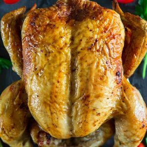 oven roasted chicken with cherry tomatoes beside it