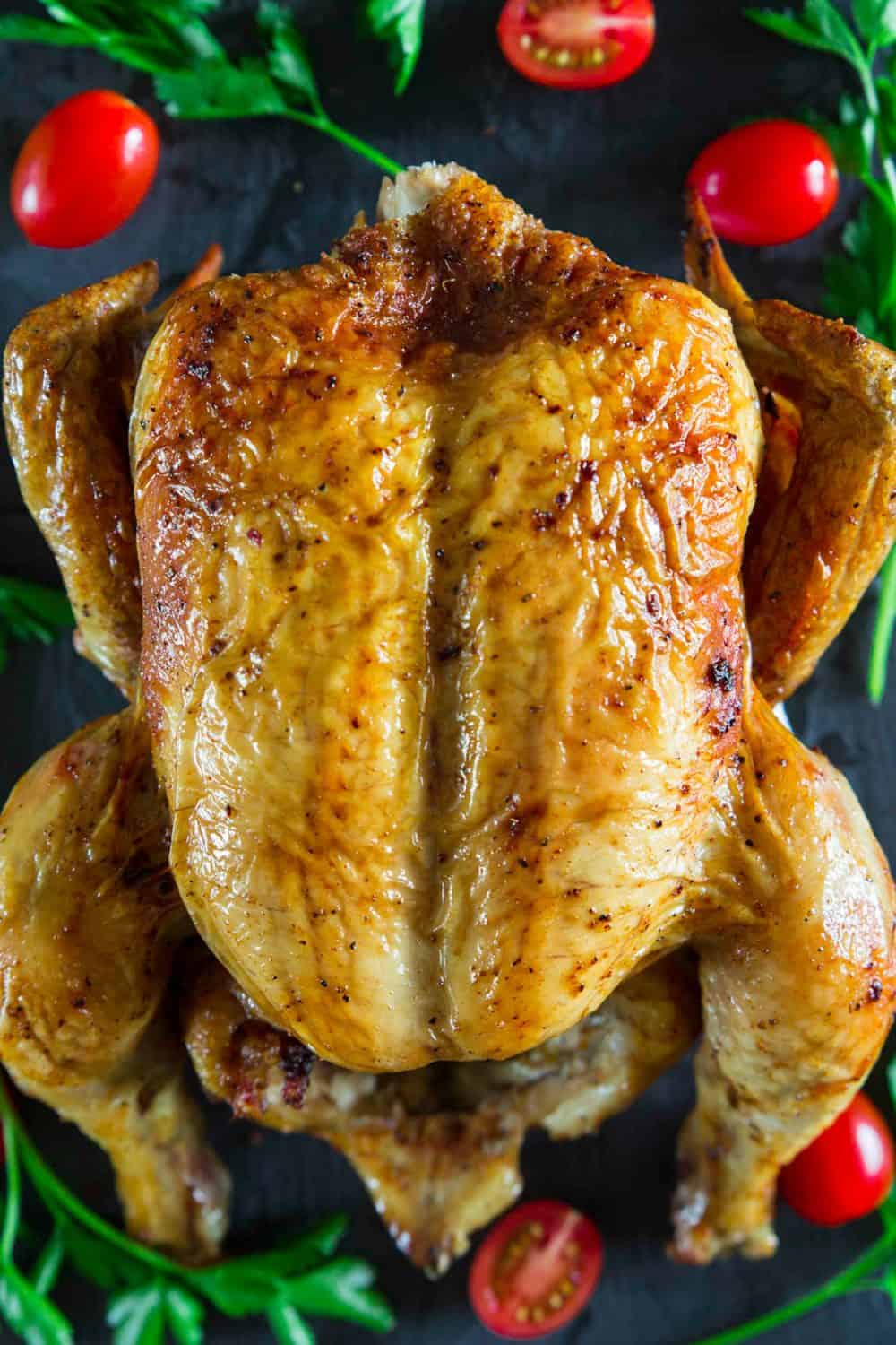 oven roasted chicken with cherry tomatoes beside it