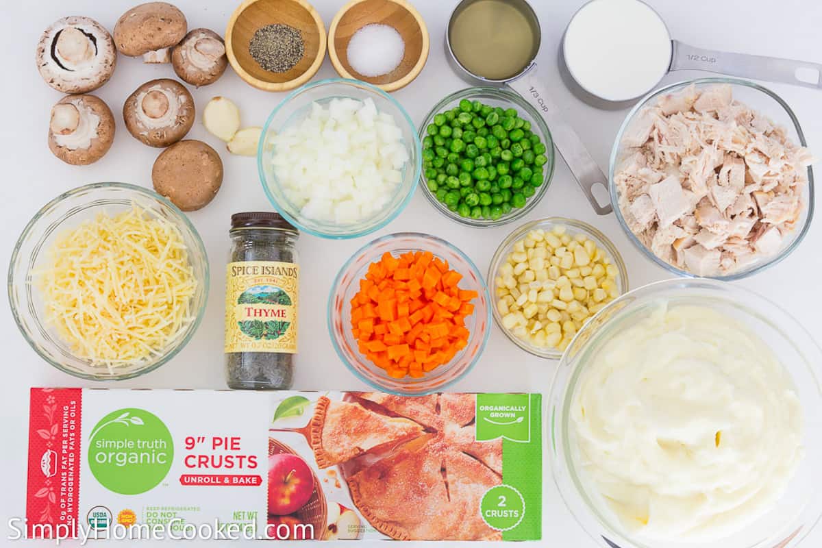 Easy and delicious thanksgiving turkey leftovers recipe! Make this tasty turkey shepherds pie! It's quick, simple, and so yummy. #turkeyleftovers #leftoverturkeyrecipe #shepherdspie #Turkeypie #savorypie an overhead image of turkey shepherds pie ingredients on a white background