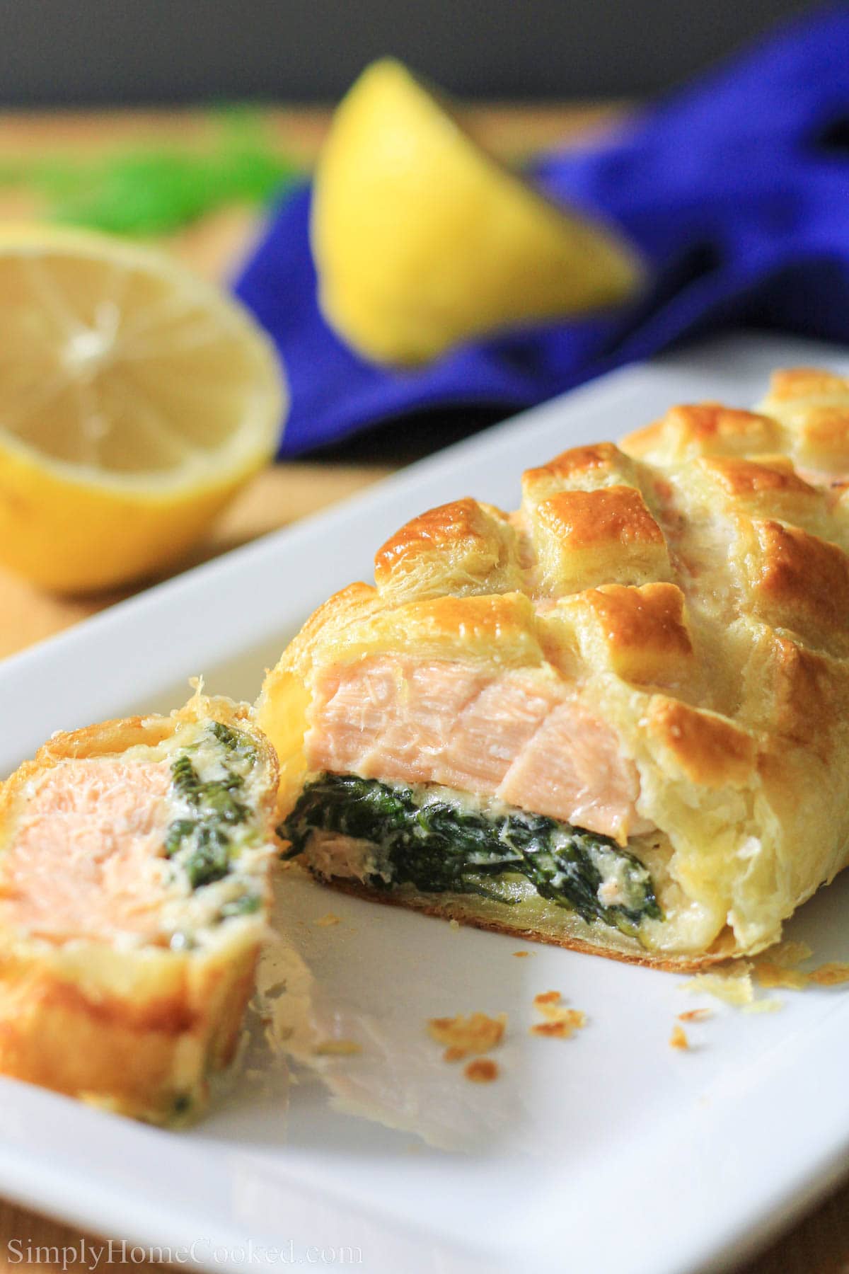 Close up of a Salmon Wellington with a slice cut off. 