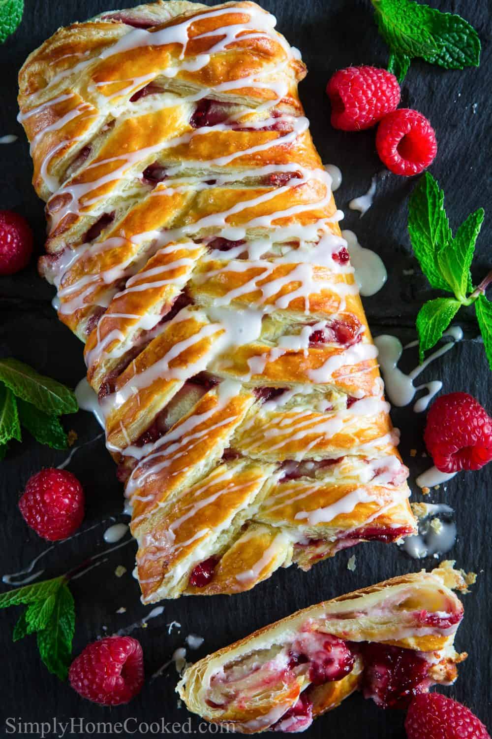 This raspberry cream cheese danish is surprisingly really easy and quick to make! This simple method of braided Danish uses puff pastry so anyone can make it! #raspberrydanish #braideddanish #creamcheesedansih #easydanish #danishrecipe A delightful homemade Raspberry Cheese Danish Recipe is ideal for breakfast. Made using homemade fillings and ready-made puff pastry, this recipe is a great breakfast or dessert.