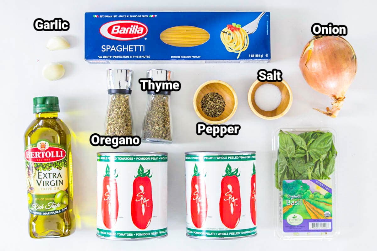 Ingredients for Spaghetti and Meatballs: spaghetti, garlic, onion, olive oil, whole tomatoes, fresh basil, thyme, oregano, salt and pepper.