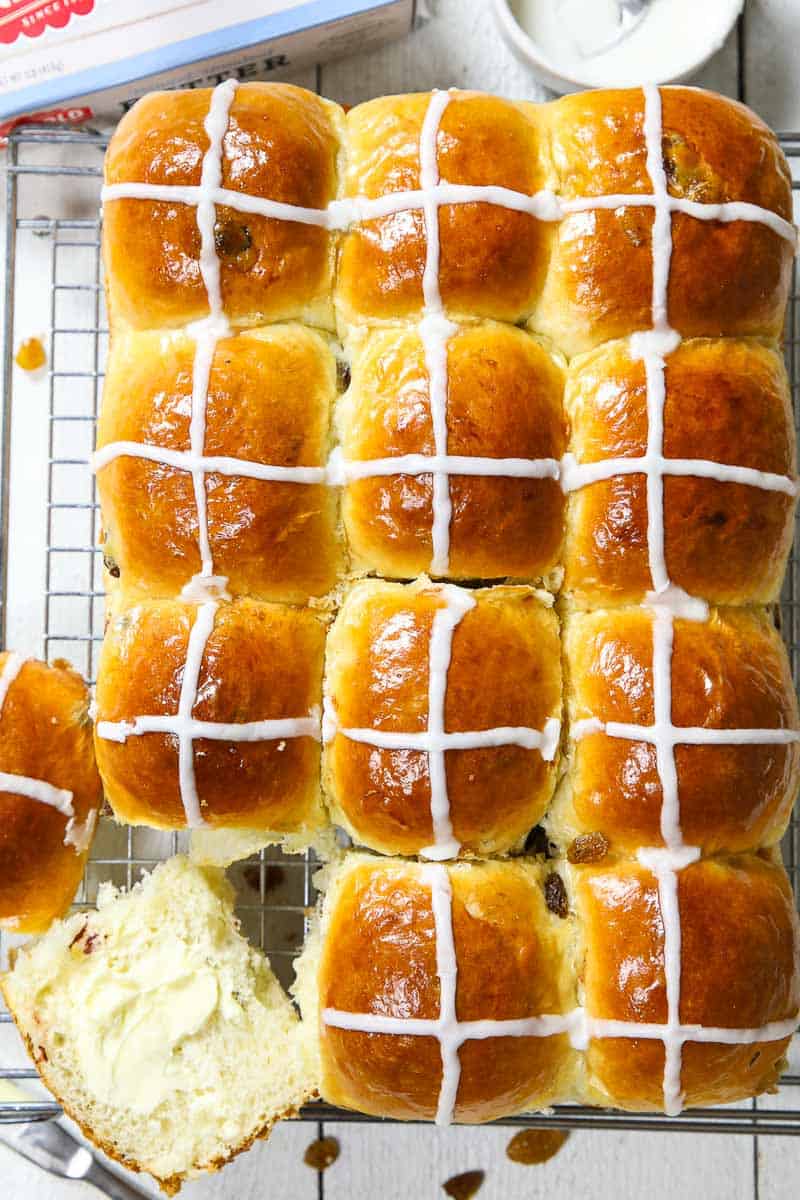 overhead image of brioche hot cross buns on a cooling rack