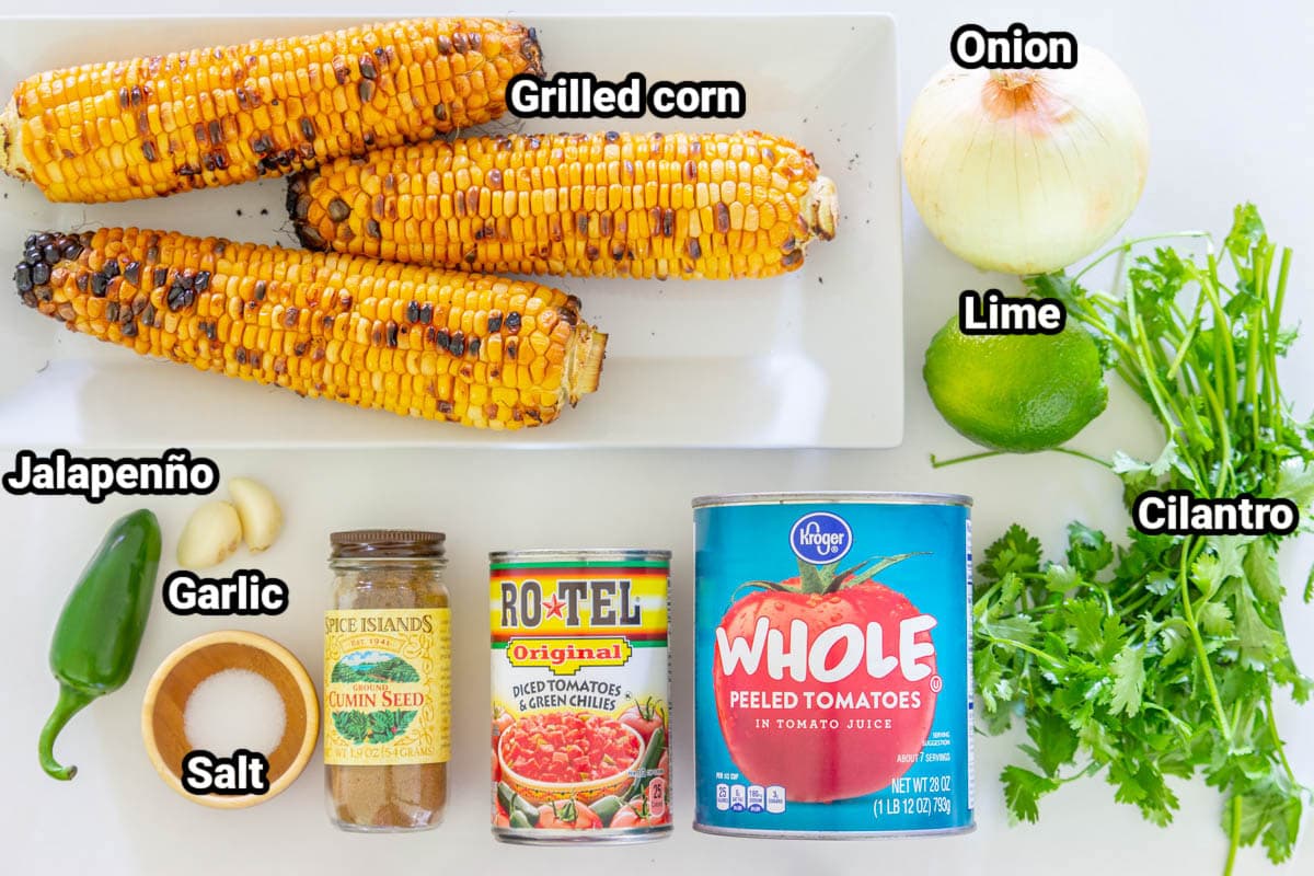 Ingredients for Grilled Corn Salsa: grilled corn, onion, lime, cilantro, whole tomatoes, diced tomatoes & green chilies, cumin, garlic cloves, salt, and jalapeno.