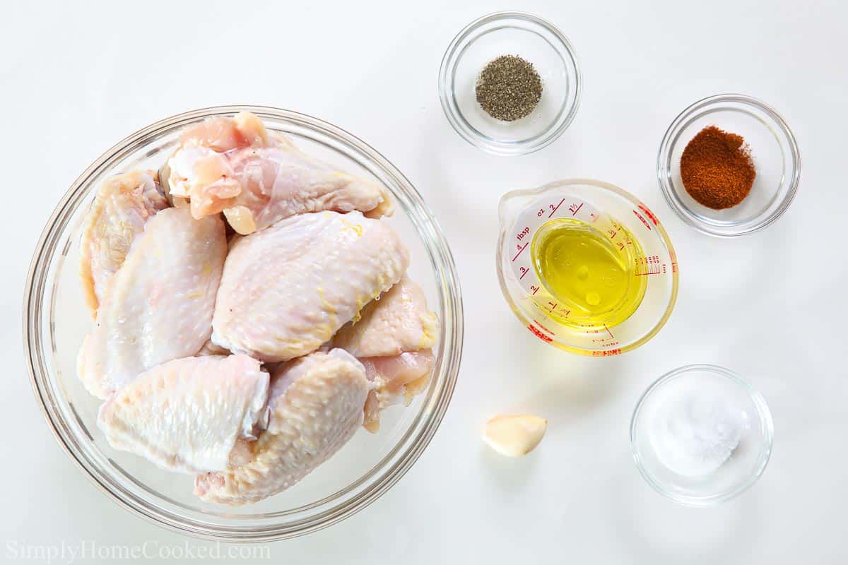 overhead image of air fryer chicken wing ingredients on a white background