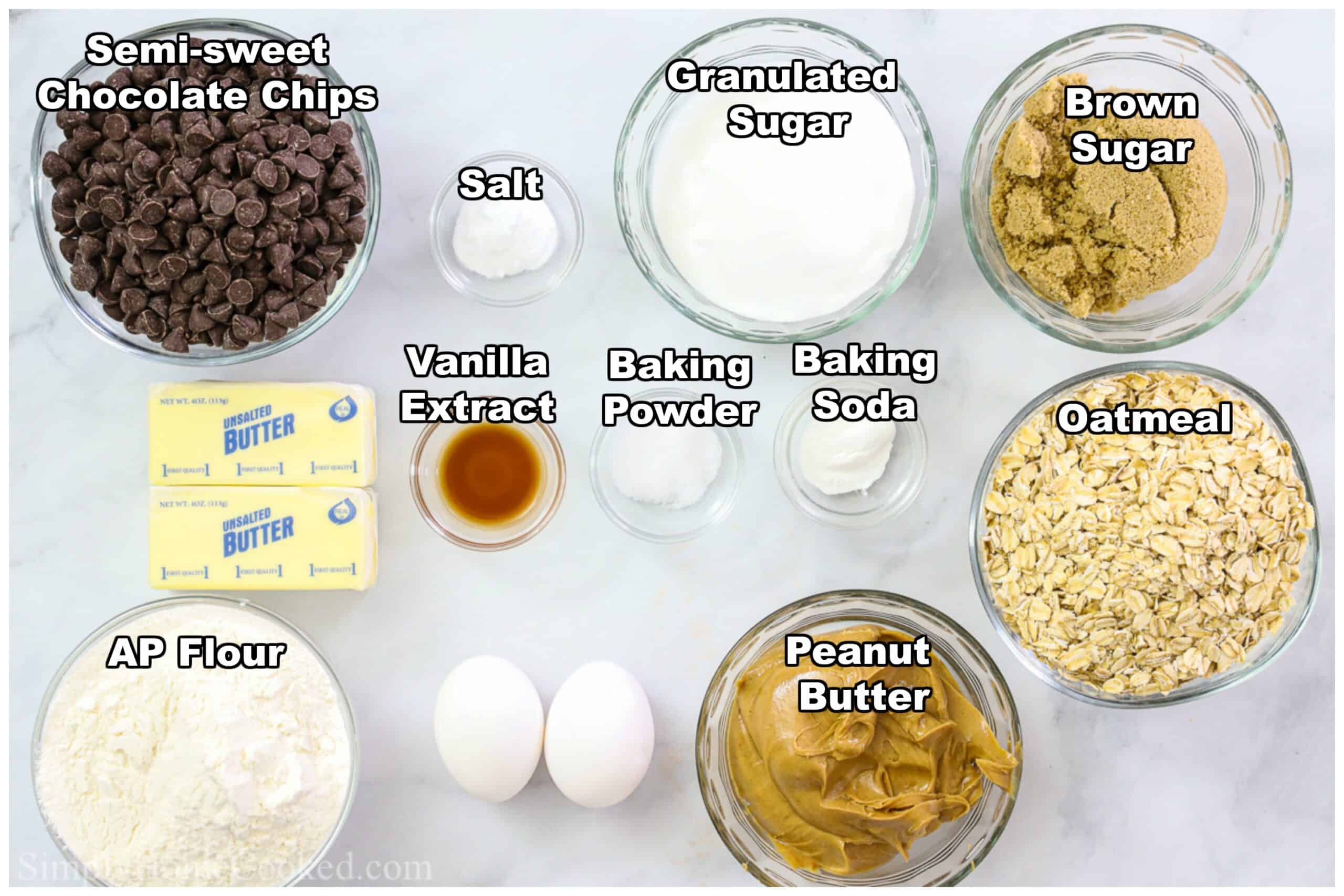Ingredients for Chewy Peanut Butter Oatmeal Cookies, including flour, granulated sugar, brown sugar, salt, oatmeal, peanut butter, vanilla extract, baking soda, baking powder, butter, and eggs.