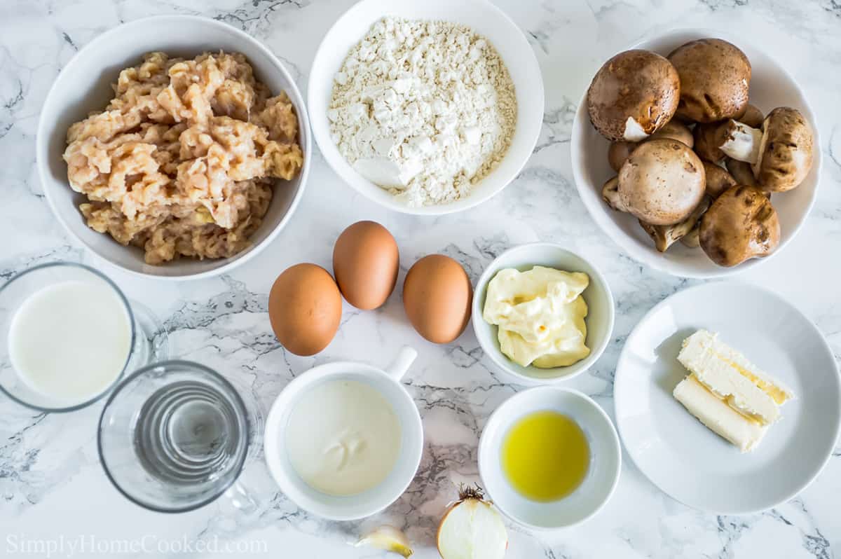 Ingredients for Savory Crepes with Chicken and Mushroom Filling, including ground chicken, baby Bella mushrooms, garlic, onion, flour, milk, water, eggs, olive oil, butter, onion, mayonnaise, and sour cream.