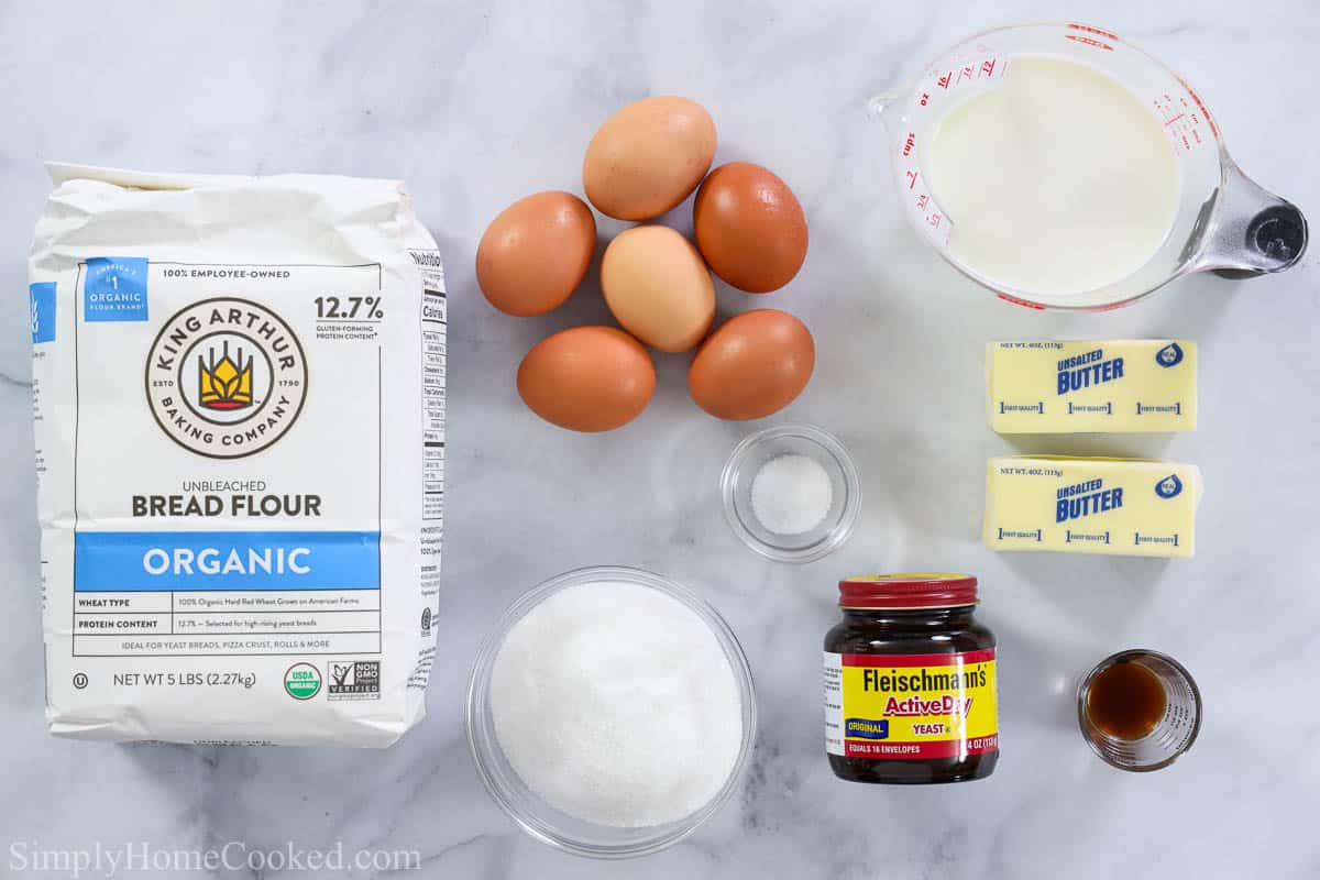 Ingredients for Buttery Brioche Bread, including bread flour, eggs, salt, milk, yeast, vanilla, butter, and sugar.