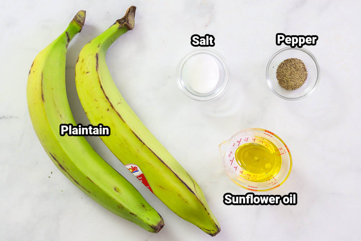 Ingredients for Baked Plantain Chips: plantains, salt, black pepper, and sunflower oil.