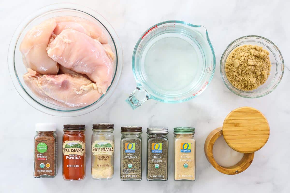 Ingredients for Smoked Chicken Breast, including chicken, water, brown sugar, salt, smoked paprika, chili powder, onion powder, garlic powder, black pepper, and oregano.