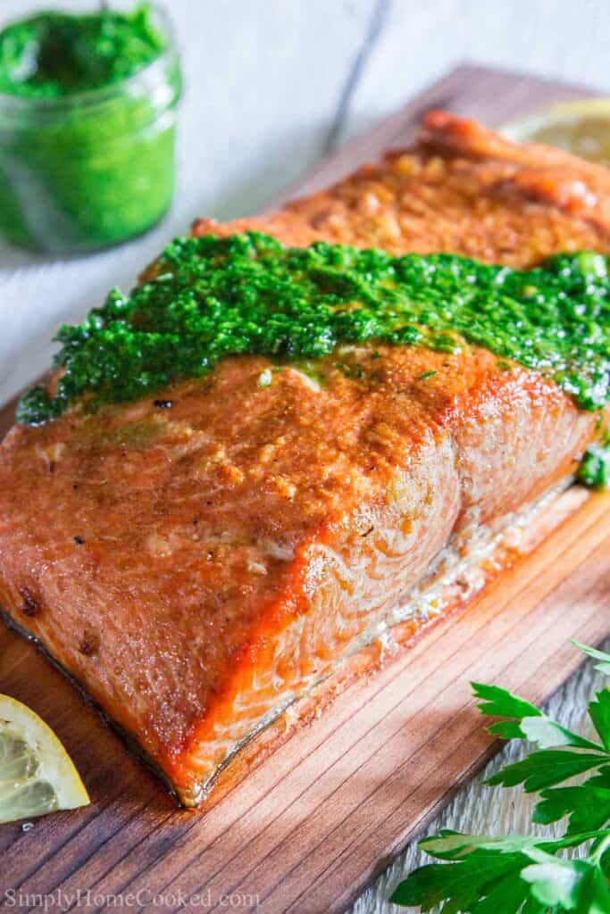 Close up of Cedar Plank Salmon with chimichurri sauce on top