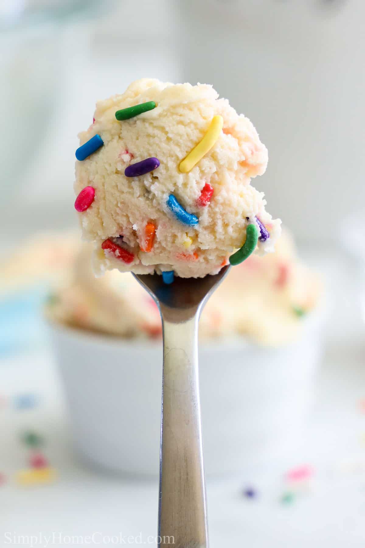 Edible Sugar Cookie Dough with rainbow sprinkles on a spoon