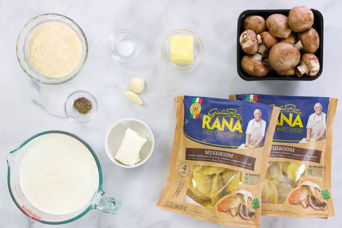 Ingredients for Mushroom Ravioli, including mushroom ravioli, heavy cream, cream cheese, butter, salt, pepper, garlic, Parmesan cheese, and Baby Bella mushrooms.