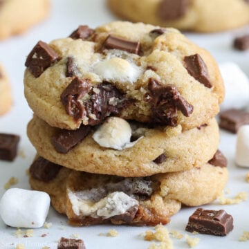 Square image of S'mores Cookies stacked with a bite missing