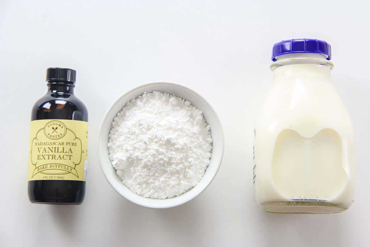 Ingredients for Apple Fritters glaze, including milk, powdered sugar, and vanilla extract.