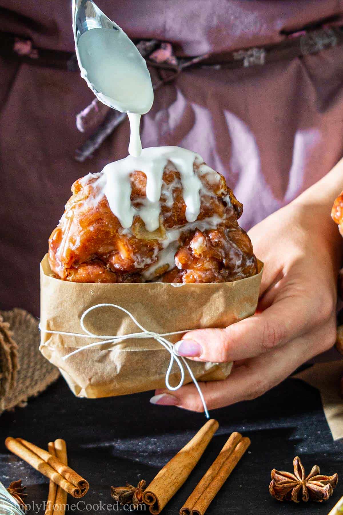 Fluffy fried apple fritters with a homemade glaze. Better than a doughnut shop. #applefritters #fritters #doughnuts #fried #applefritter Apple Fritters drizzled with glaze