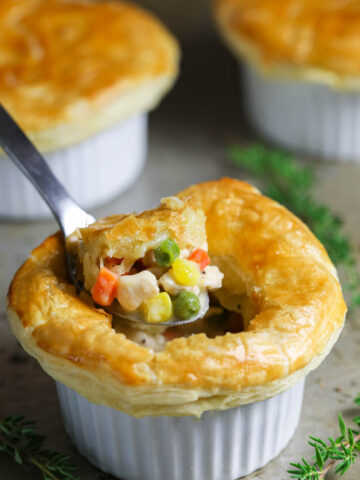 Vertical image of a spoonful of Mini Chicken Pot Pie.