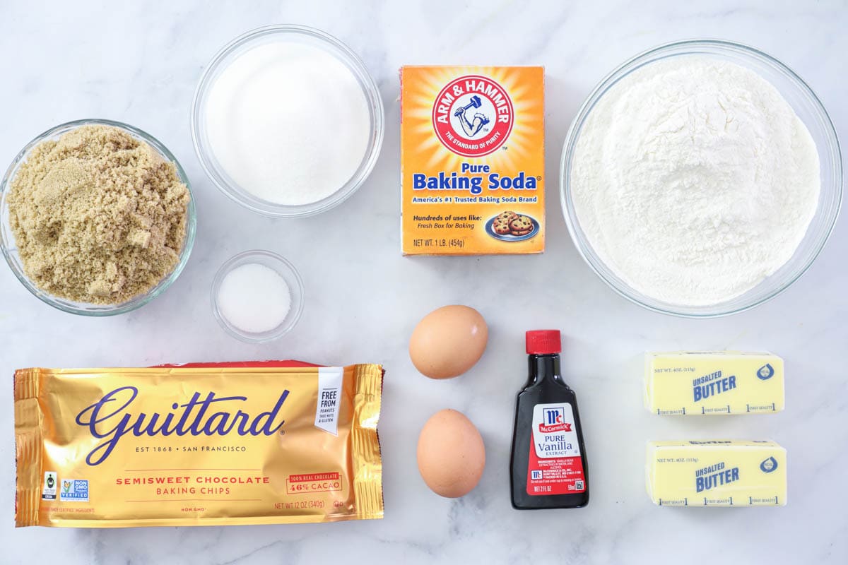 Ingredients for Chewy Chocolate Chip Cookies, including sugar, brown sugar, vanilla, eggs, butter, flour, baking soda, salt, and chocolate chips.