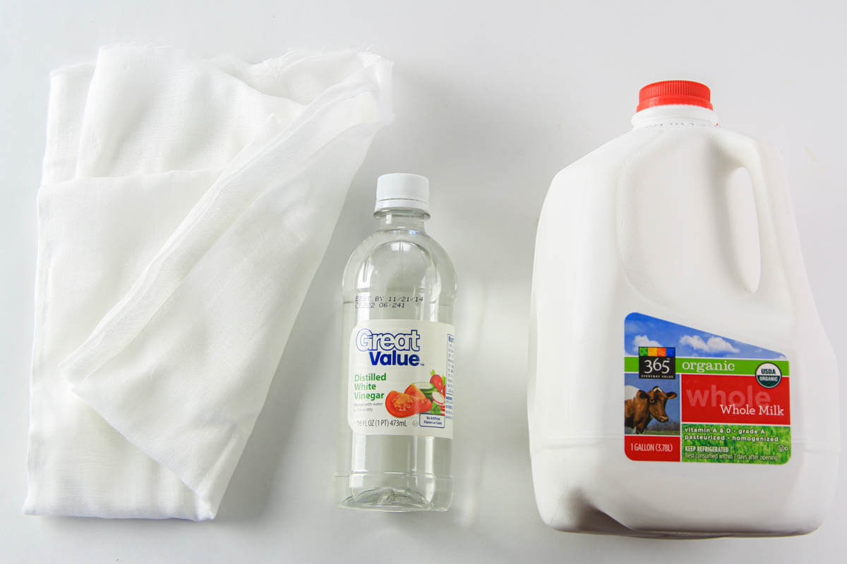 Ingredients for Farmer's Cheese including whole milk, white vinegar, and cheesecloth.