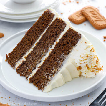 a slice of gingerbread cake on a white plate