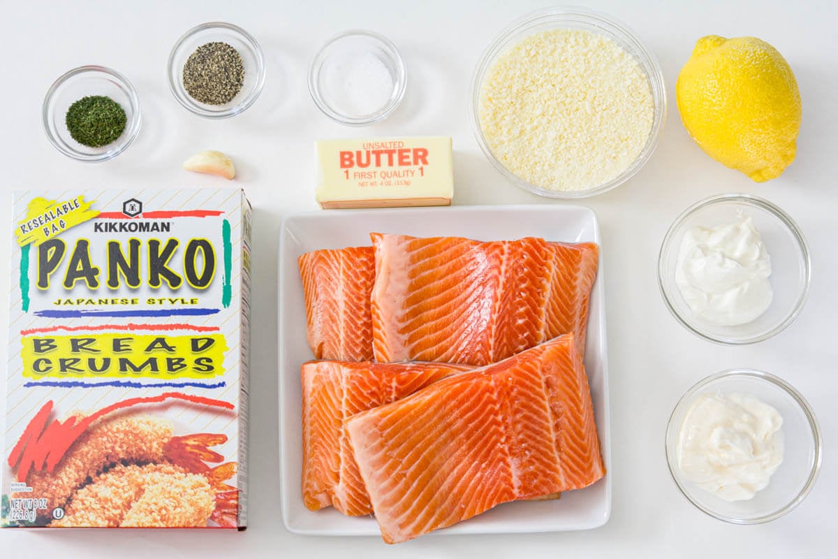 Ingredients for Panko Crusted Salmon, including salmon fillets, panko, lemon, garlic, Parmesan, mayonnaise, sour cream, salt, pepper, butter, and dill.