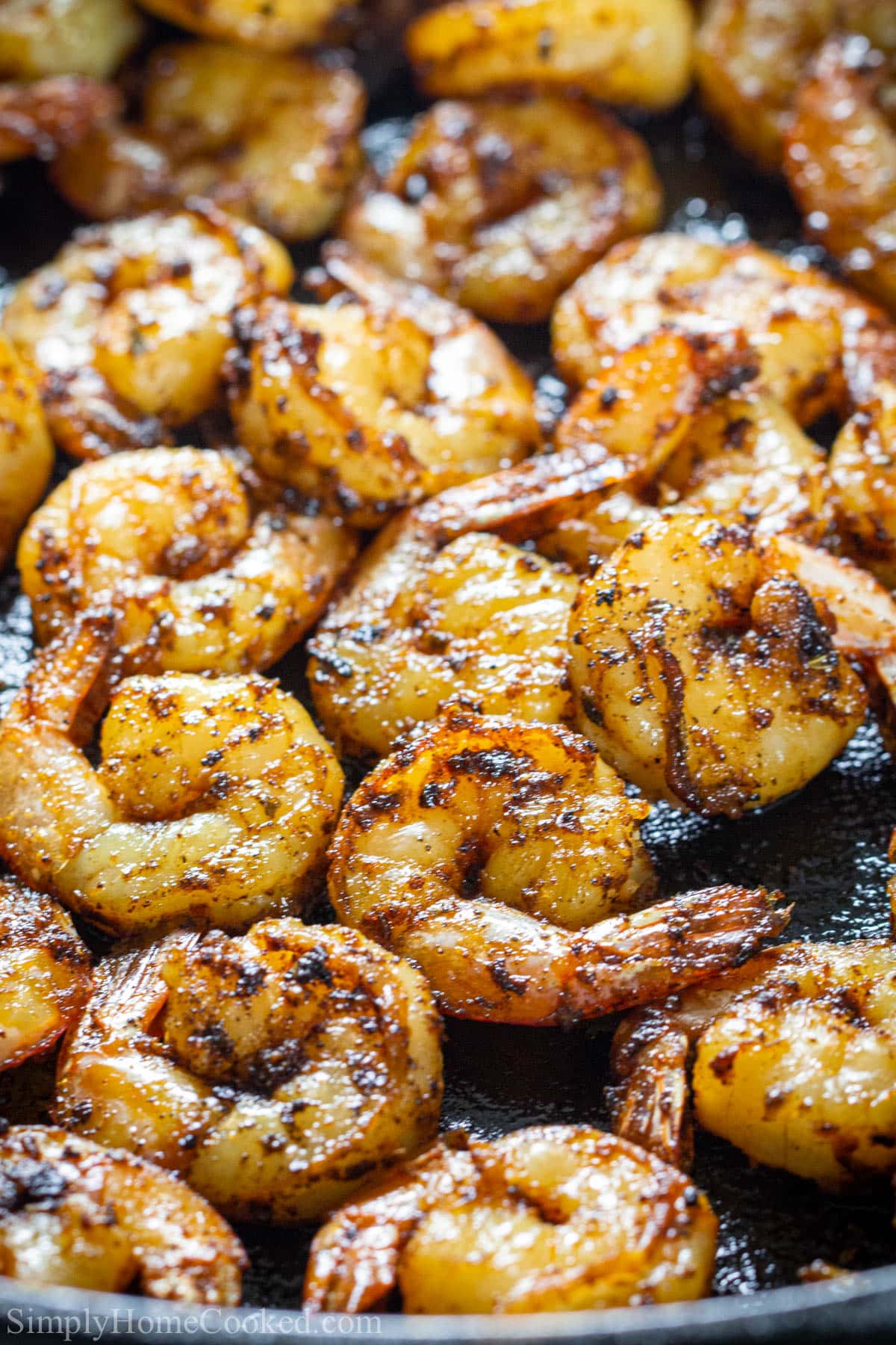 These Easy 10-minute Blackened Cajun Shrimp are super easy to make and so tasty. You can add them to your favorite pastas or salads, or just eat them as is. #easyblackenedshrimp #blackenedshrimp #cajunshrimp #blackenedcajunshrimp Cajun Shrimp in a skillet