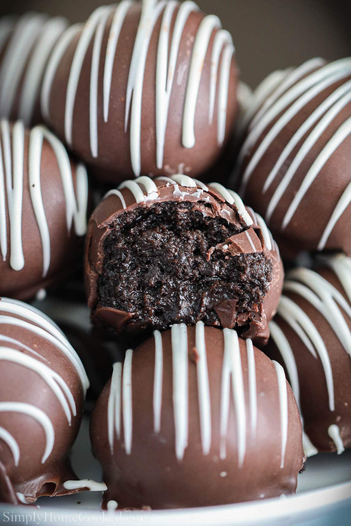 Close up of Oreo Truffles, one missing a bite.