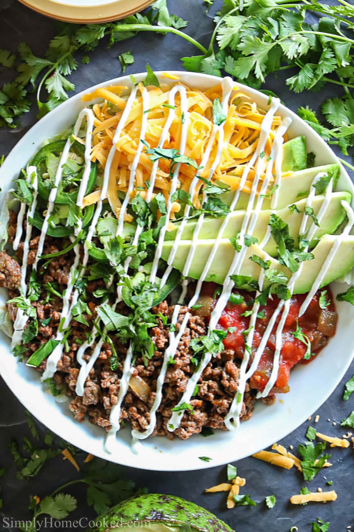 Vertical overhead image of Taco Salad Recipe in a white bowl