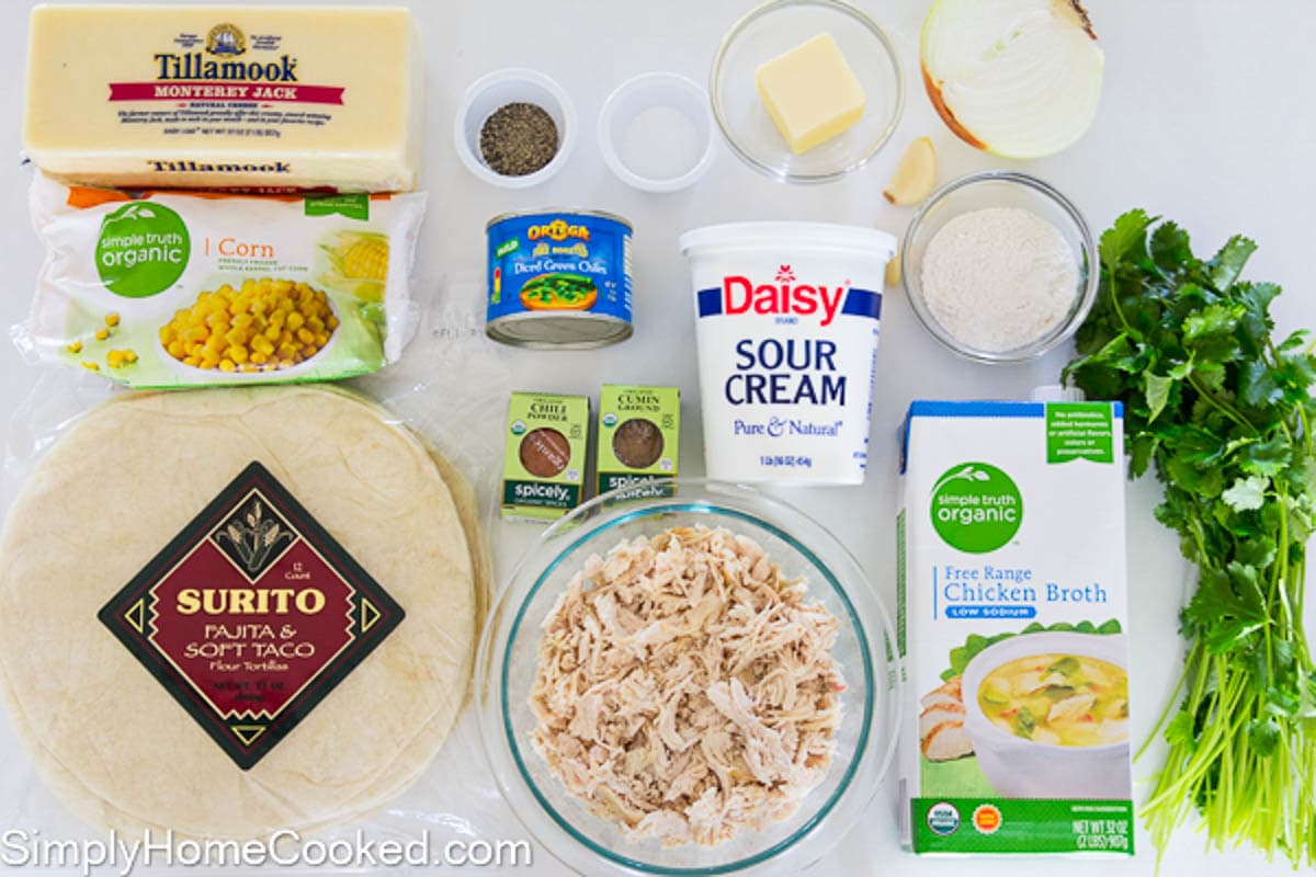 Ingredients for White Chicken Enchiladas, including cheese, corn, green chiles, tortillas, chicken, chili powder, cumin, salt, pepper, butter, sour cream, garlic, chicken broth, flour, cilantro, and onion.