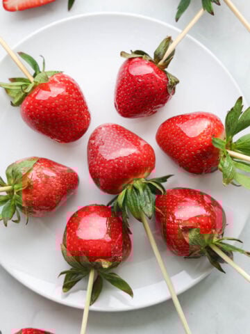 Strawberry Tanghulu arranged on a white plate