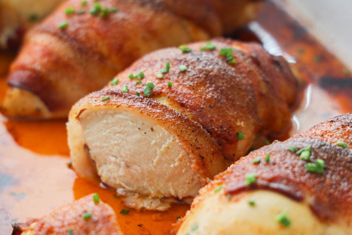 Close up of Bacon Wrapped Chicken in a baking dish