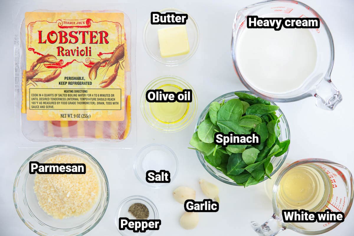 Ingredients for Lobster Ravioli, including lobster ravioli, olive oil, butter, heavy cream, Parmesan cheese, spinach, salt, pepper, garlic, and white wine.