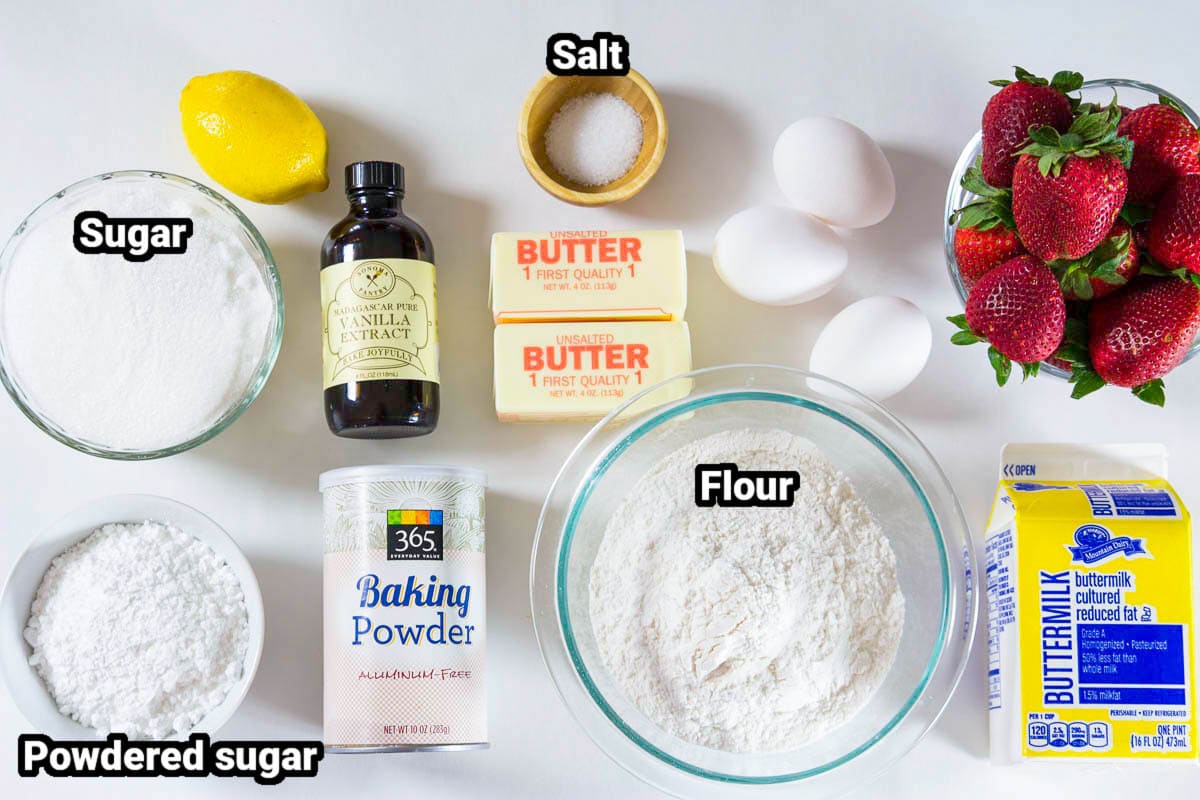 Ingredients for Strawberry Bundt Cake, including strawberries, lemon, butter, eggs, salt, sugar, powdered sugar, baking powder, flour, buttermilk, and vanilla.