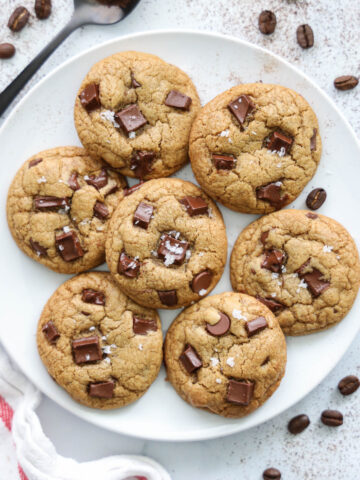 Plate of Coffee Cookies with a spoon an espresso beans nearby