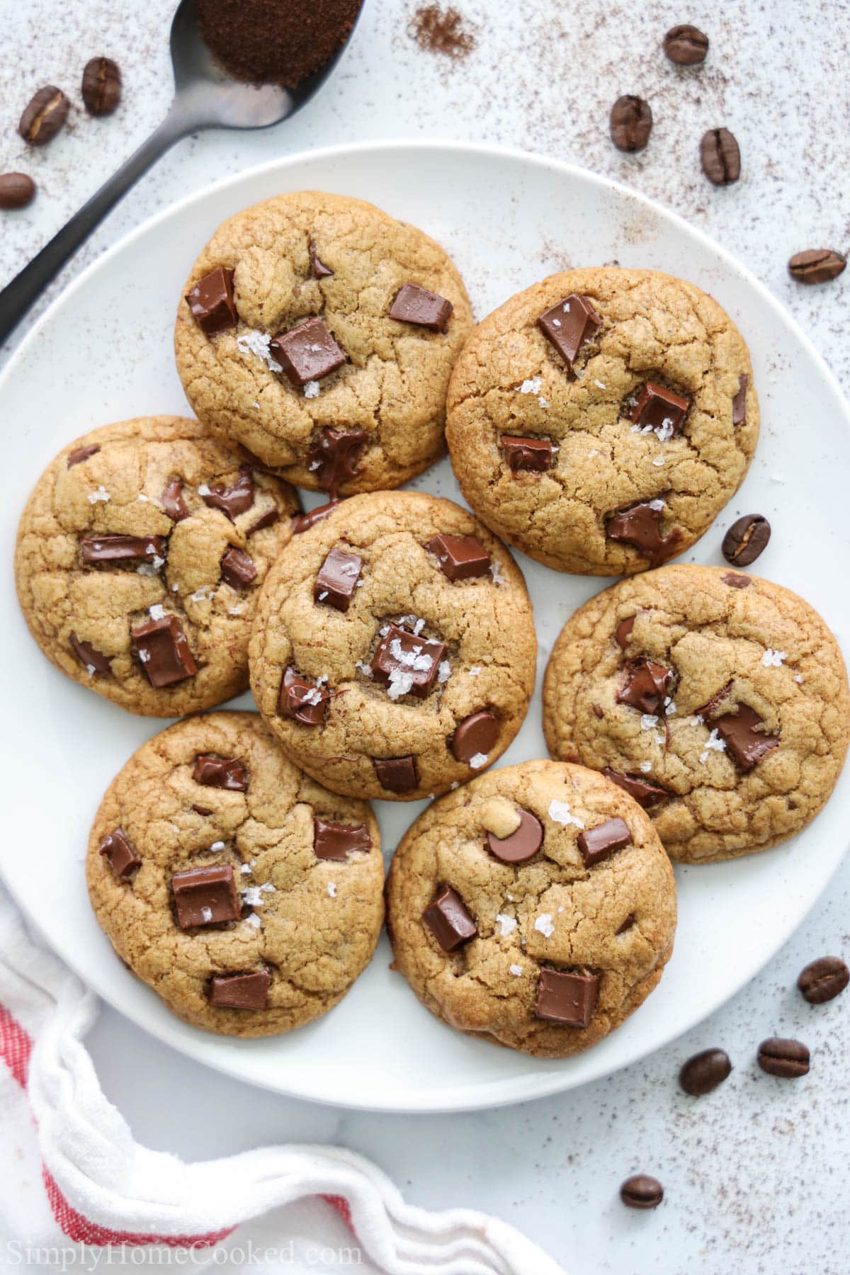Plate of Coffee Cookies with a spoon an espresso beans nearby