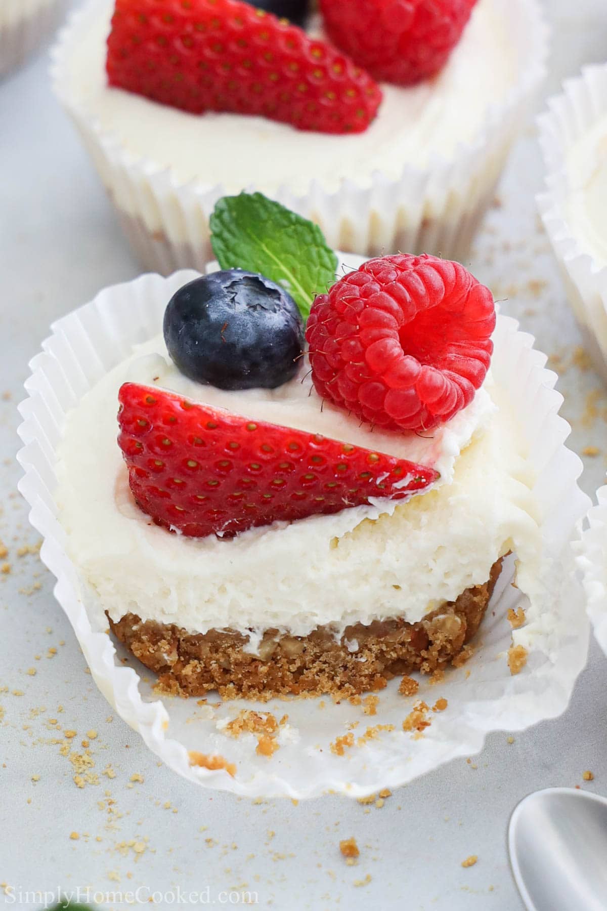 Close up of No Bake Mini Cheesecakes topped with fresh berries