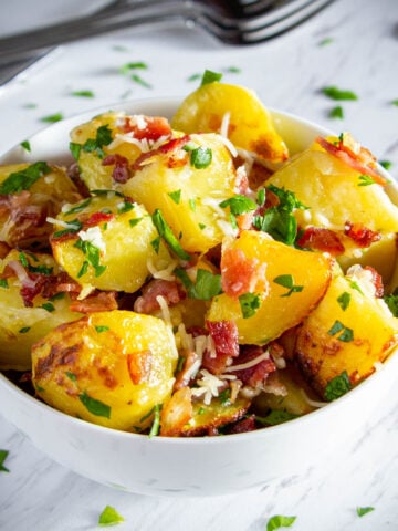 Close up of a bowl of Parmesan Roasted Potatoes