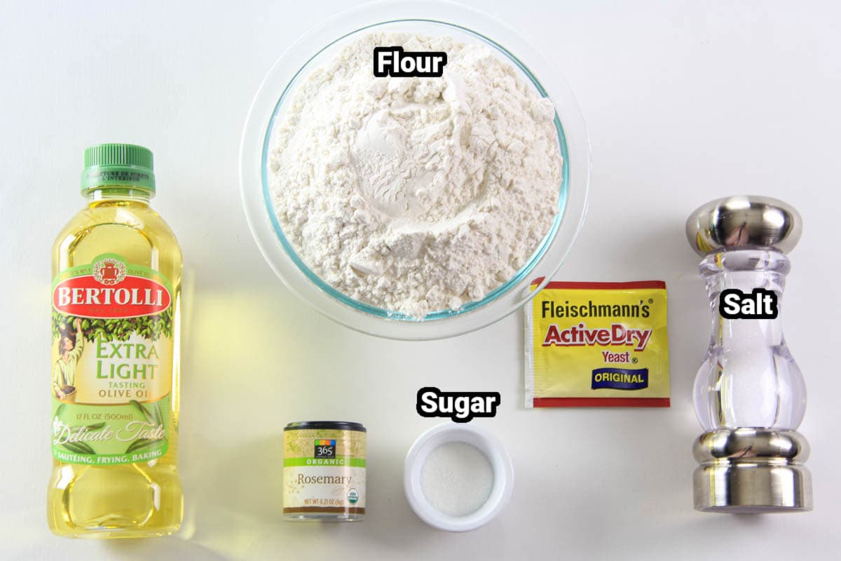 Ingredients for Focaccia Bread: flour, olive oil, salt, yeast, sugar, and rosemary.
