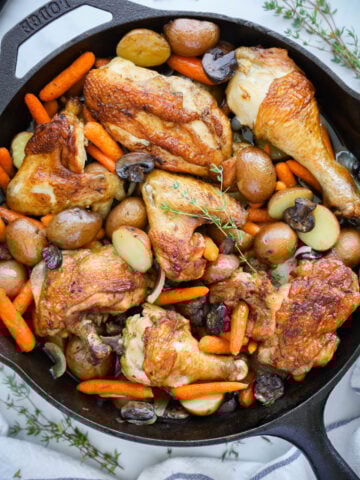 One Pan Chicken and Potatoes in a cast iron skillet
