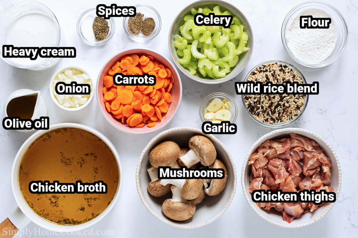 Ingredients for Chicken Wild Rice Soup: chicken broth, chicken thighs, mushrooms, carrots, celery, wild rice blend, onion, heavy cream, flour, olive oil, and spices.