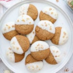 Plate of Gingersnap Cookies with spices and chocolate wafers nearby.