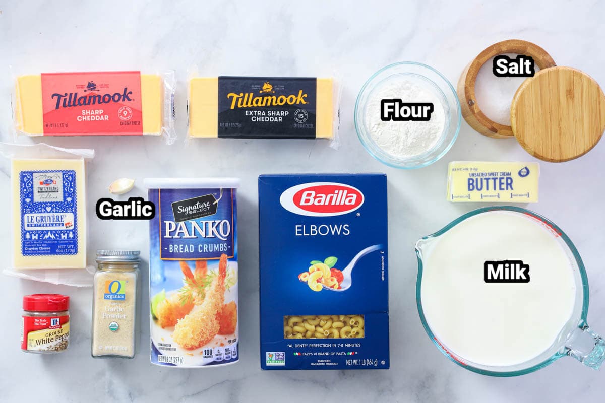 Ingredients for Mac and Cheese: sharp cheddar, extra sharp cheddar, swiss cheese, panko, macaroni pasta, garlic cloves, salt, flour, milk, butter, white pepper, and garlic powder.