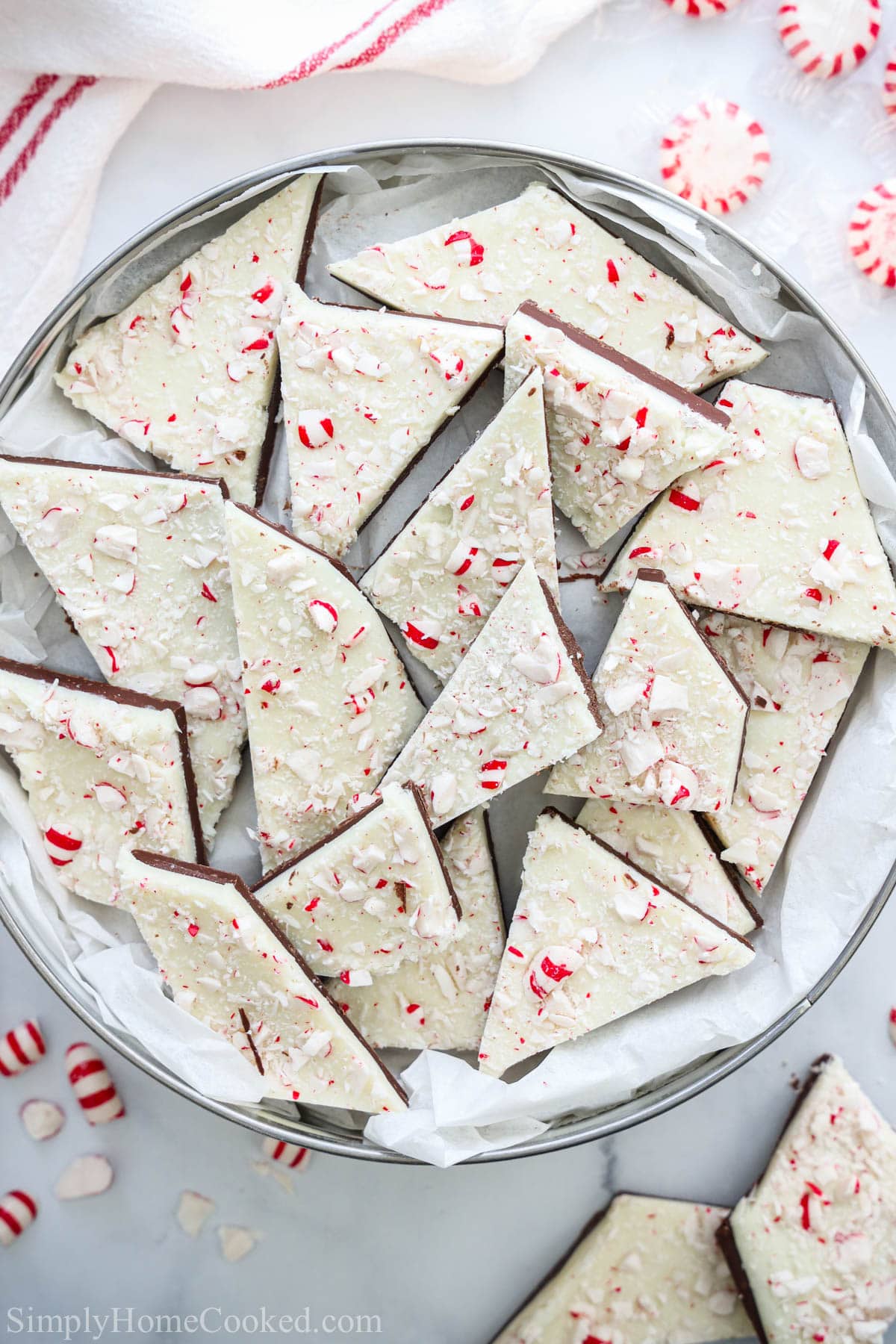 Pile of Peppermint Bark in a silver tin.