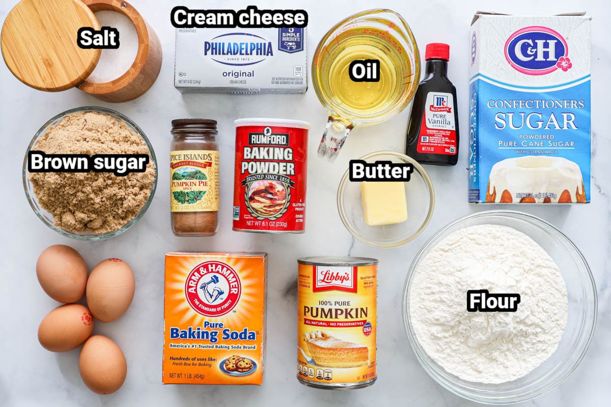 Ingredients for Pumpkin Cake: flour, brown sugar, powdered sugar, vanilla, pumpkin puree, butter, eggs, oil, baking powder, baking spda, pumpkin spice, and cream cheese.