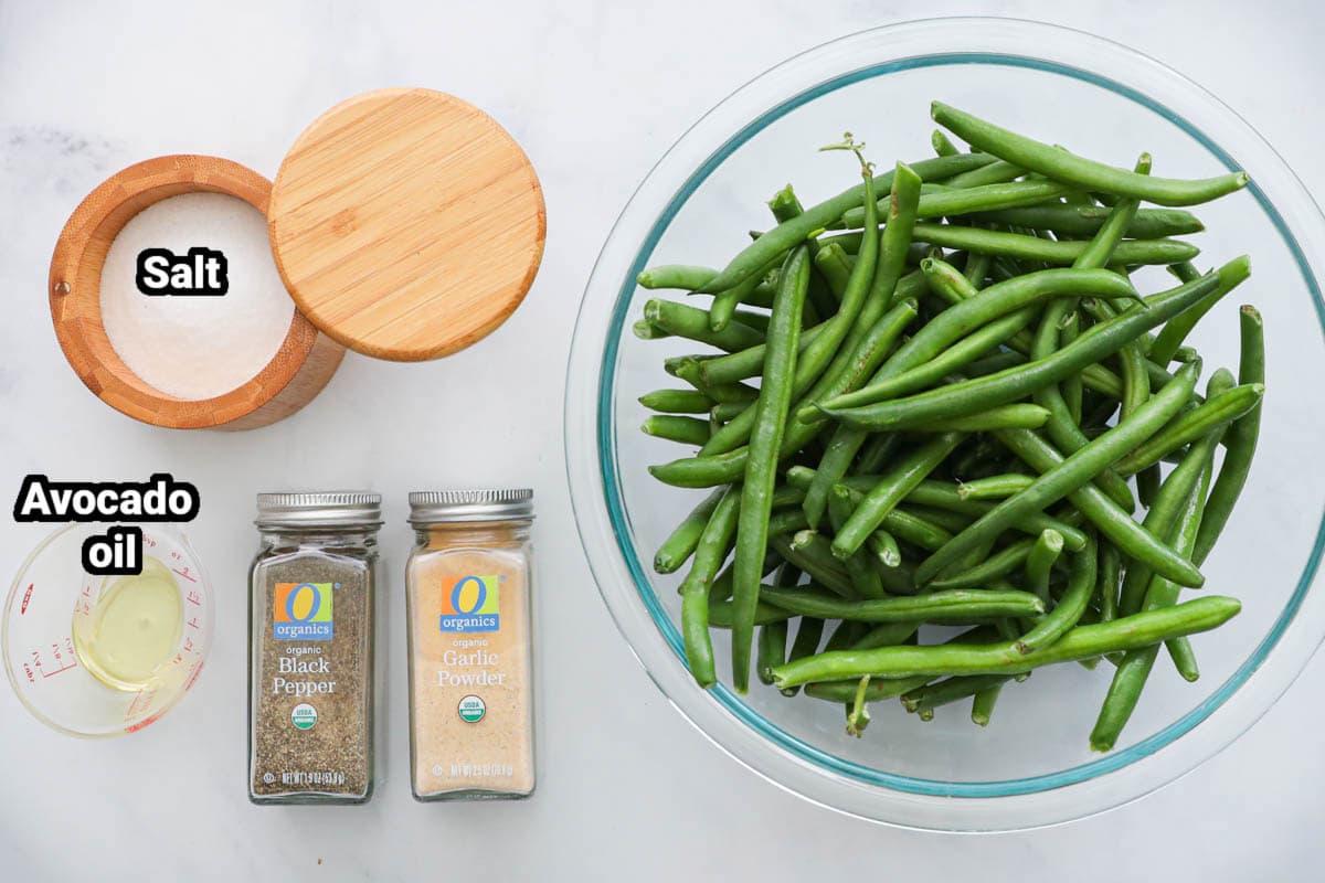 Ingredients for Air Fryer Green Beans: green beans, avocado oil, salt, pepper, and garlic powder. 
