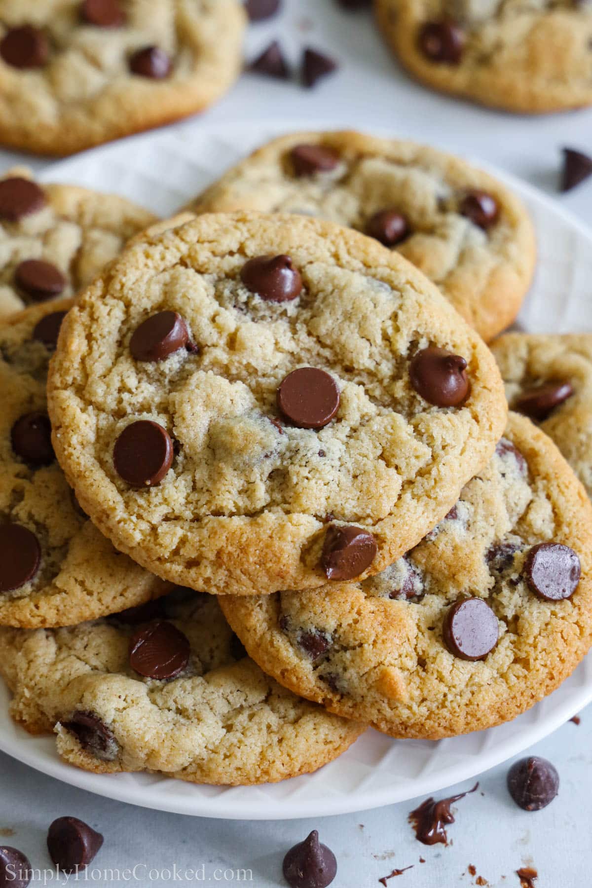 These amazing Almond Flour Chocolate Chip Cookies are deliciously soft with melted chocolate chips. They are also gluten-free and so easy to make! #almondflourchocolatechipcookies #almondflourcookies #chocolatechipcookies #glutenfreechocolatechipcookies Pile of Almond Flour Chocolate Chip Cookies